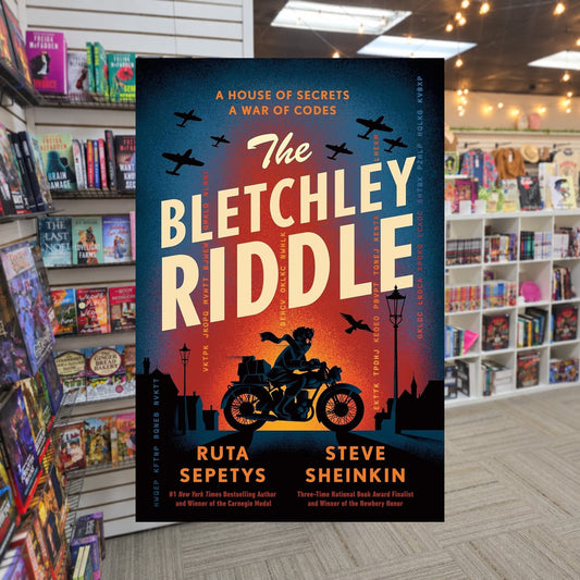 The Bletchley Riddle by Ruta Sepetys — actual cover on The Perk bookstore background