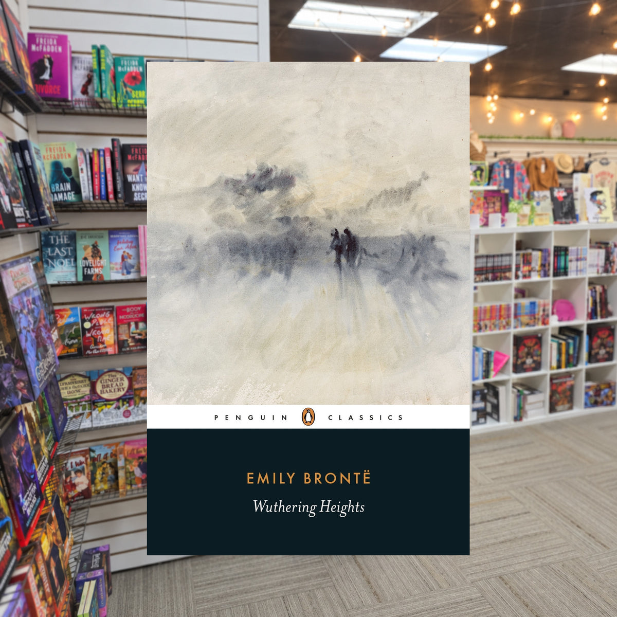Wuthering Heights by Emily Brontë — actual cover on The Perk bookstore background