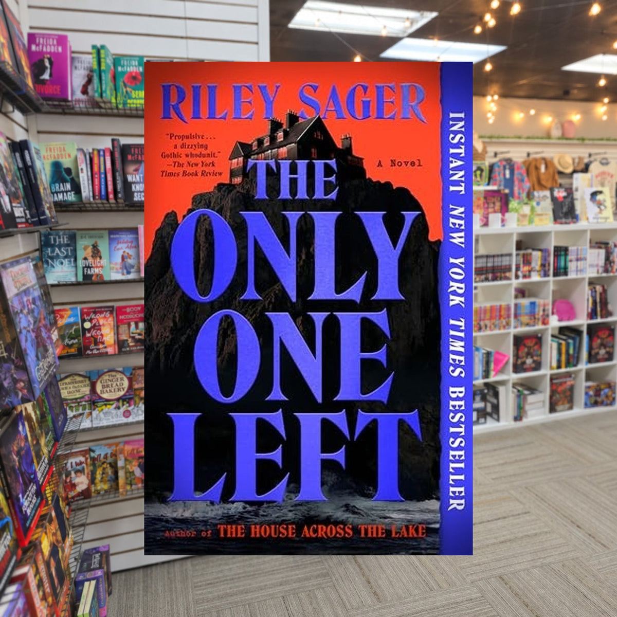 The Only One Left by Riley Sager — actual cover on The Perk bookstore background