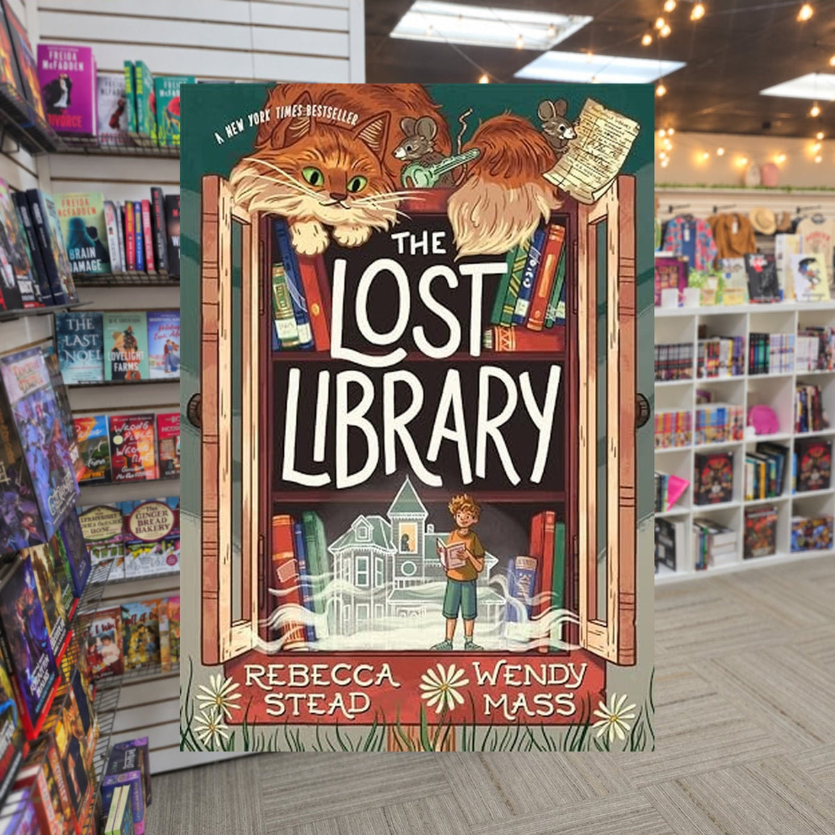The Lost Library by Rebecca Stead — actual cover on The Perk bookstore background