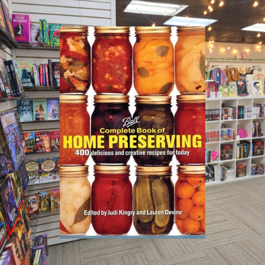 Ball Complete Book of Home Preserving: 400 Delicious and Creative Recipes for Today by Sarah Page — actual cover on The Perk bookstore background