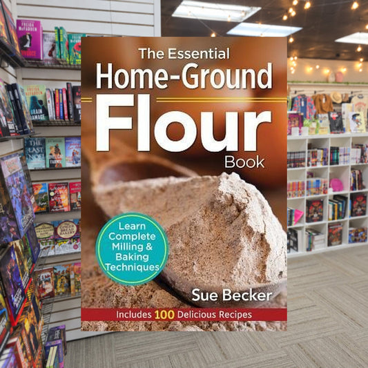 The Essential Home-Ground Flour Book: Learn Complete Milling and Baking Techniques by Sue Becker — actual cover on The Perk bookstore background