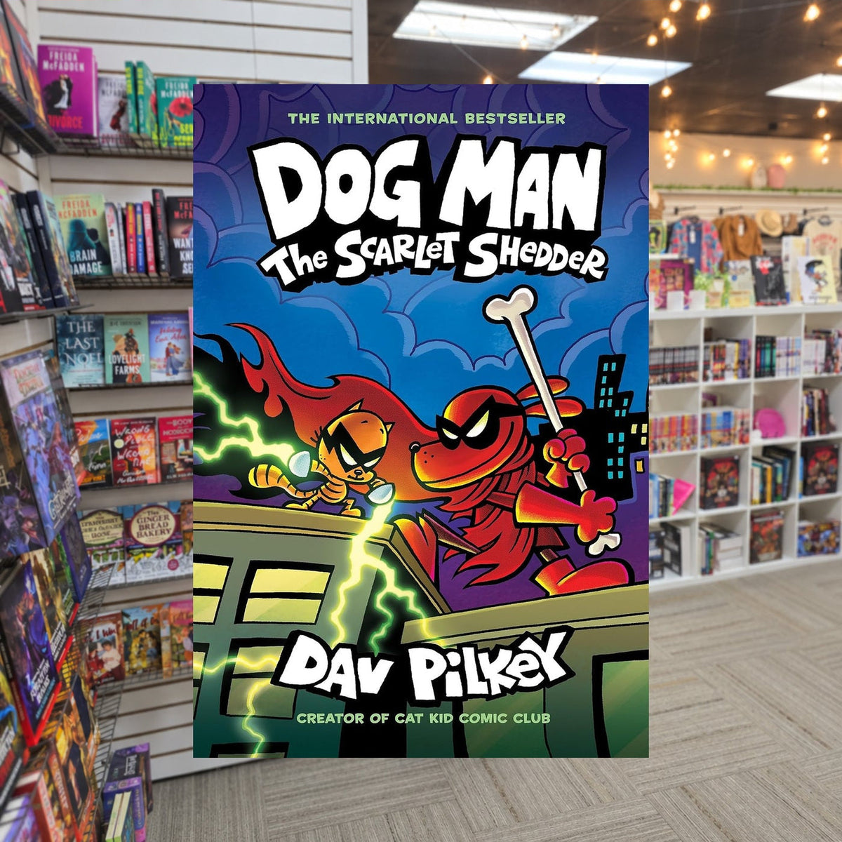 Dog Man: The Scarlet Shedder by Dav Pilkey — actual cover on The Perk bookstore background