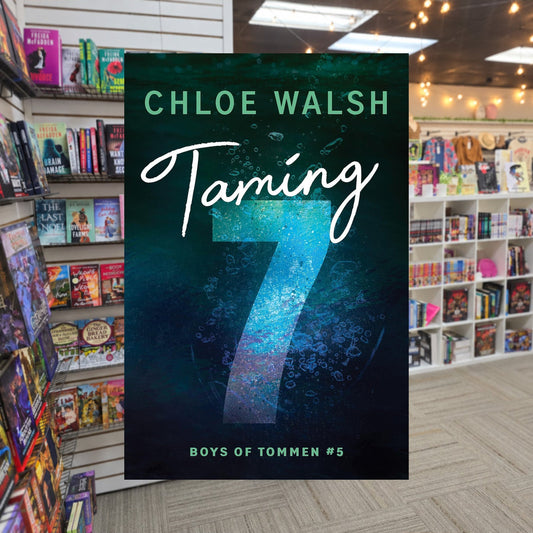 Boys of Tommen #5: Taming 7 by Chloe Walsh — actual cover on The Perk bookstore background