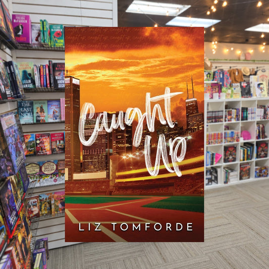 Caught Up by Liz Tomforde — actual cover on The Perk bookstore background