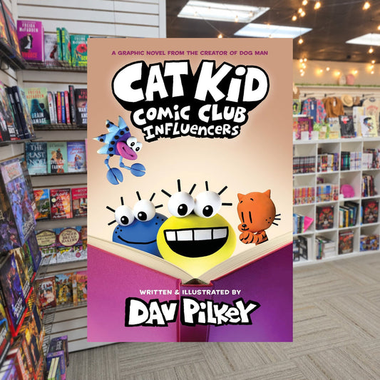 Cat Kid Comic Club: Influencers: A Graphic Novel by Dav Pilkey — actual cover on The Perk bookstore background