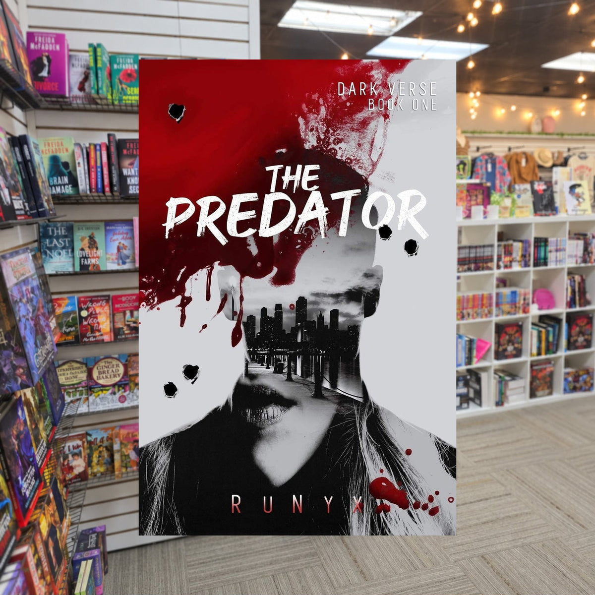 The Predator by RuNyx — actual cover on The Perk bookstore background