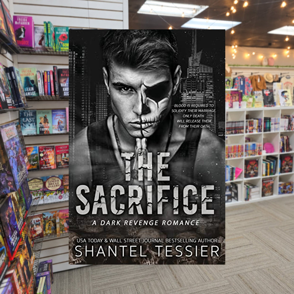 The Sacrifice by Shantel Tessier — actual cover on The Perk bookstore background