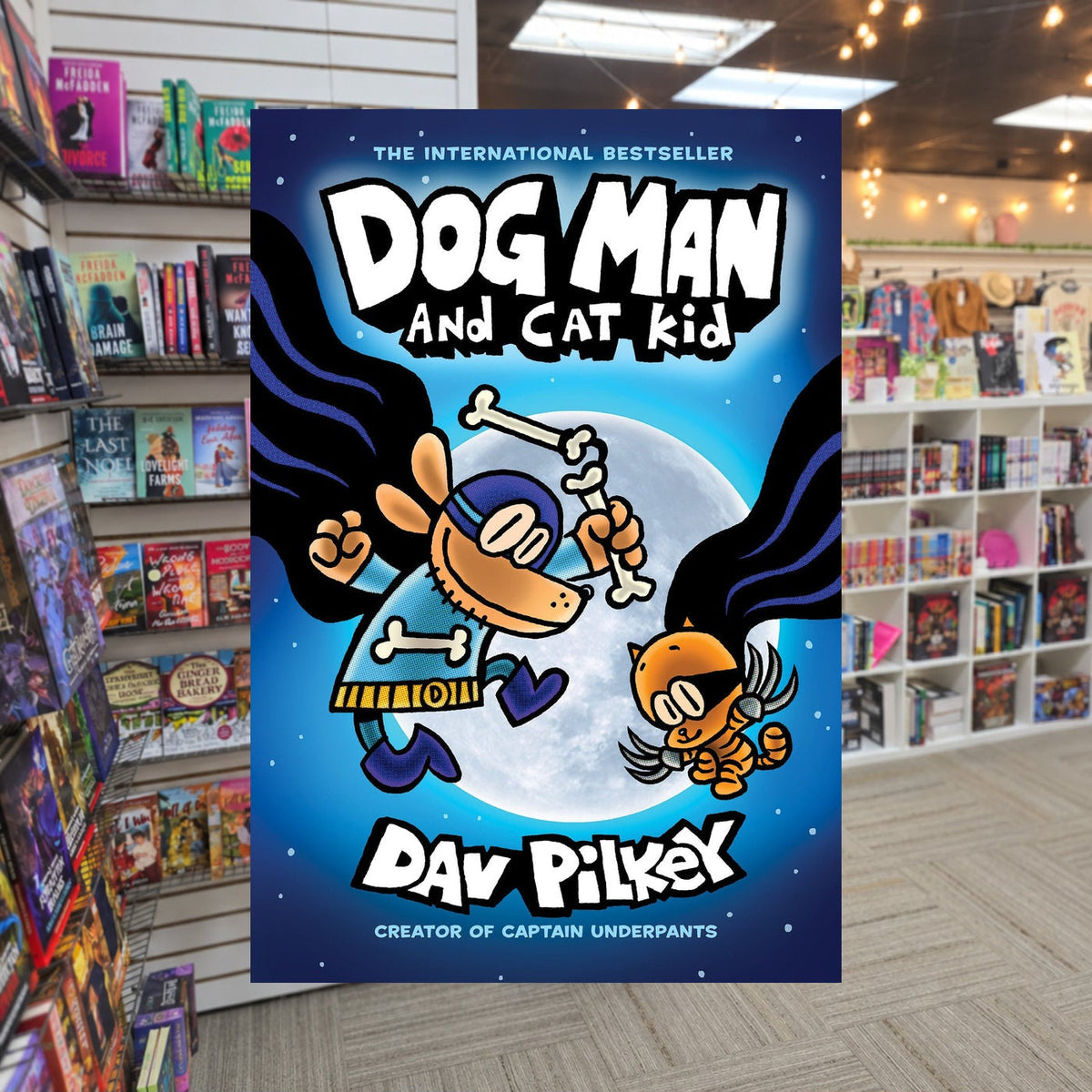 Dog Man and Cat Kid by Dav Pilkey — actual cover on The Perk bookstore background