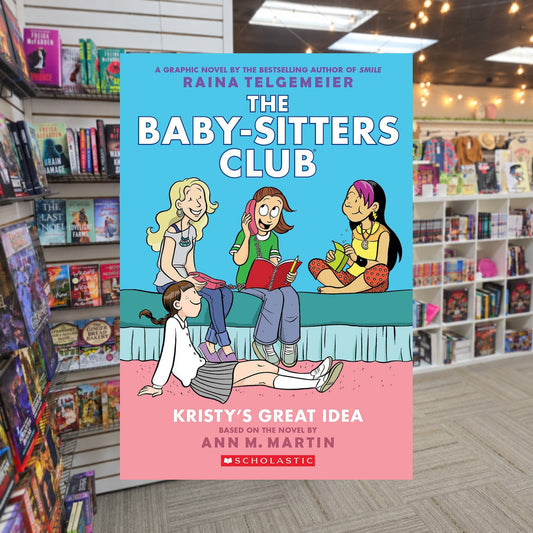 Kristy's Great Idea: A Graphic Novel (The Baby-Sitters Club #1) by Raina Telgemeier — actual cover on The Perk bookstore background