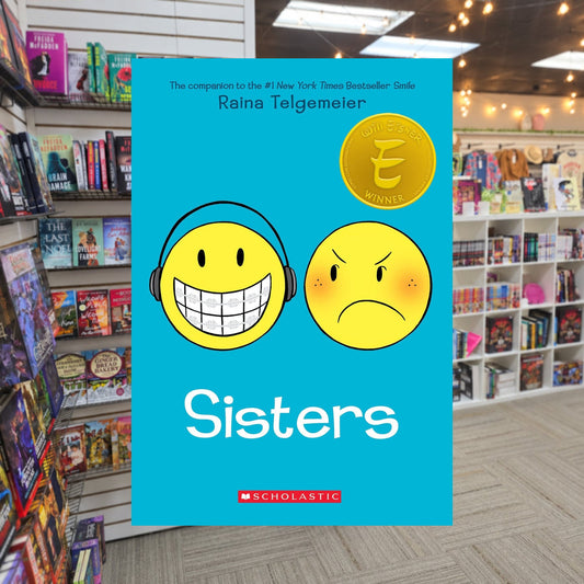 Sisters: A Graphic Novel by Raina Telgemeier — actual cover on The Perk bookstore background