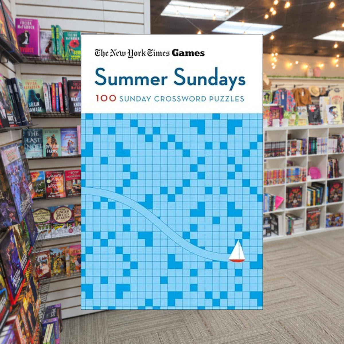 NYT Games Summer Sundays by Will Shortz — actual cover on The Perk bookstore background