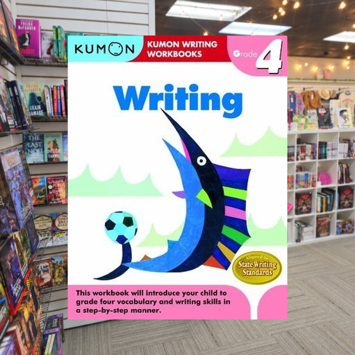 Kumon Grade 4 Writing by Kumon Publishing — actual cover on The Perk bookstore background