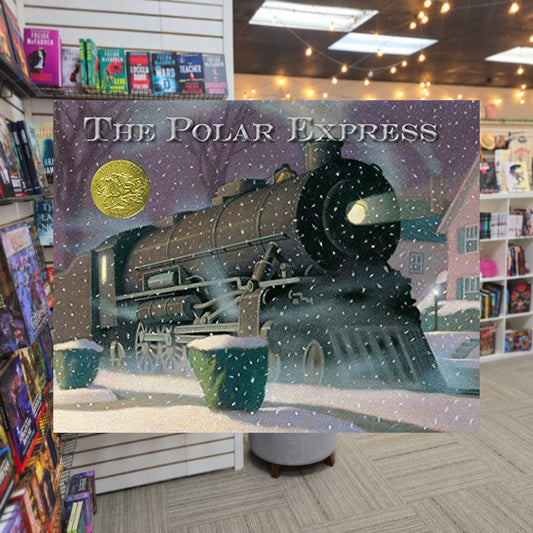 The Polar Express: A Caldecott Award Winner by Chris Van Allsbur — actual cover on The Perk bookstore background