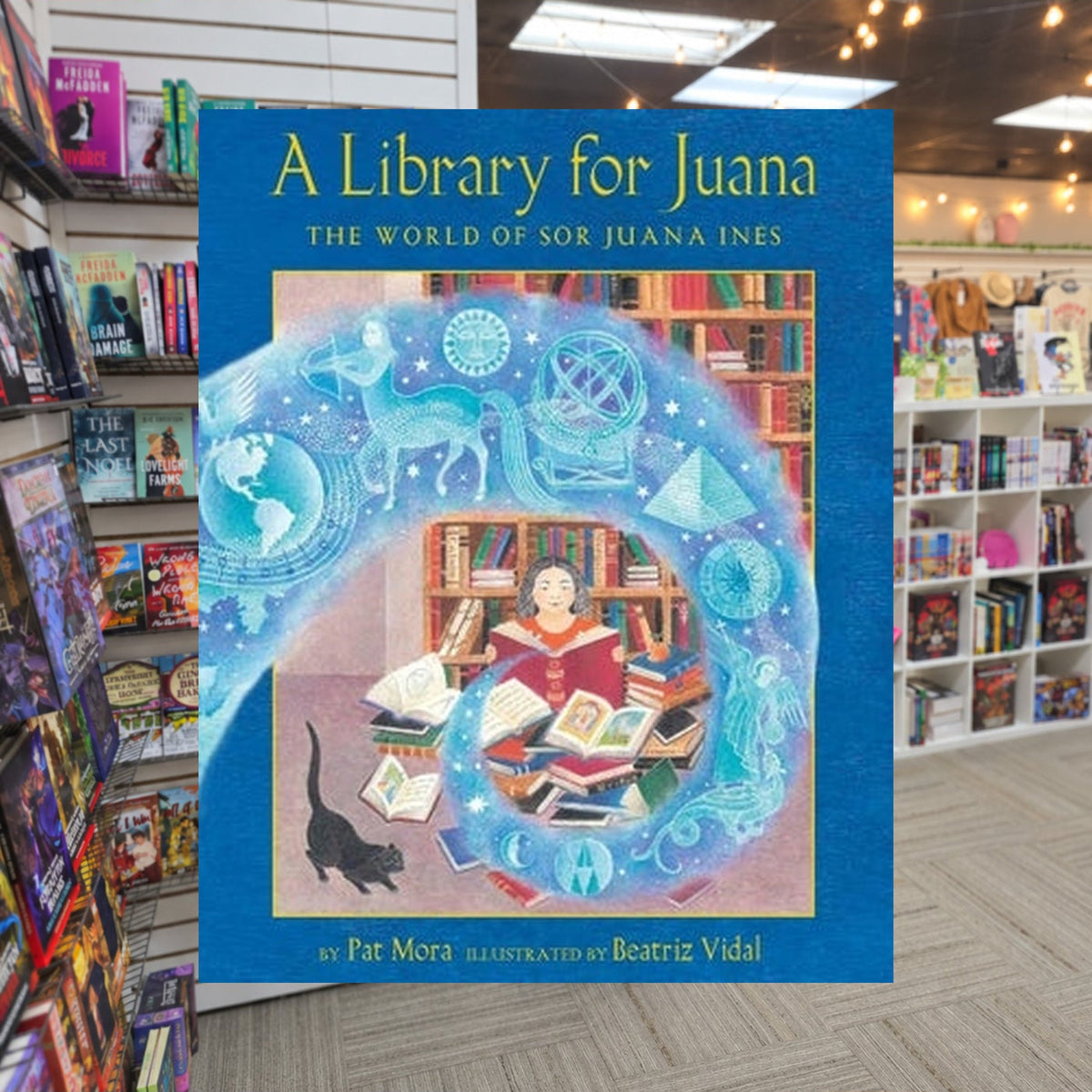 A Library for Juana: The World of Sor Juana Inés by Pat Mora — actual cover on The Perk bookstore background