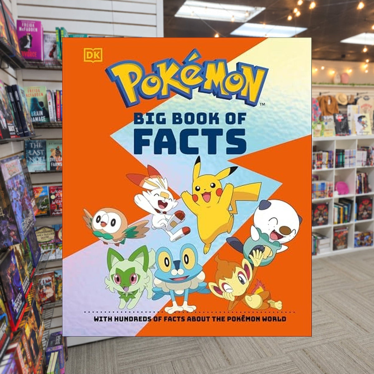 Pokemon Big Book of Facts by Simon Beecroft — actual cover on The Perk bookstore background