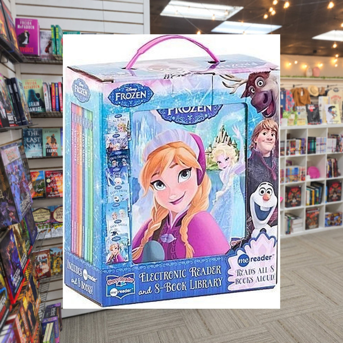 Disney Frozen Elsa, Anna, Olaf, and More! - Me Reader Electronic Reader and 8-Sound Book Library – Great Alternative to Toys for Christmas - PI Kids by Phoenix International Publications — actual cover on The Perk bookstore background