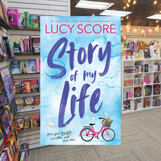 Story Lake #1: Story of My Life by Lucy Score — actual cover on The Perk bookstore background