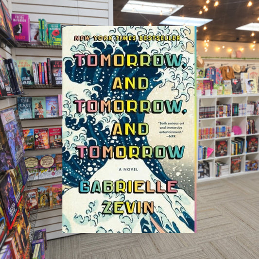 Tomorrow, and Tomorrow, and Tomorrow by Gabrielle Zevin — actual cover on The Perk bookstore background