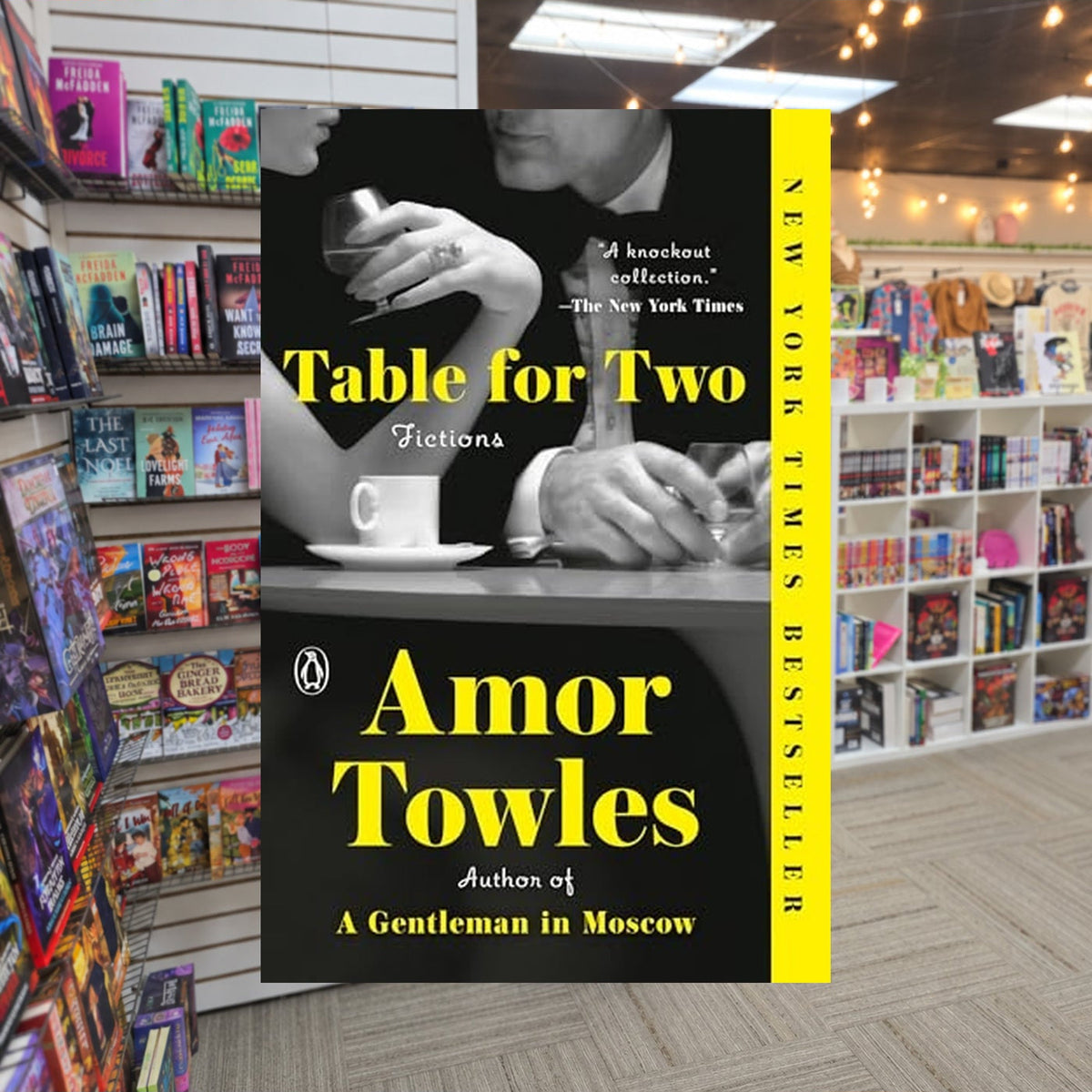 Rules of Civility #1.5 incl'd Table for Two: Fictions by Amor Towles — actual cover on The Perk bookstore background