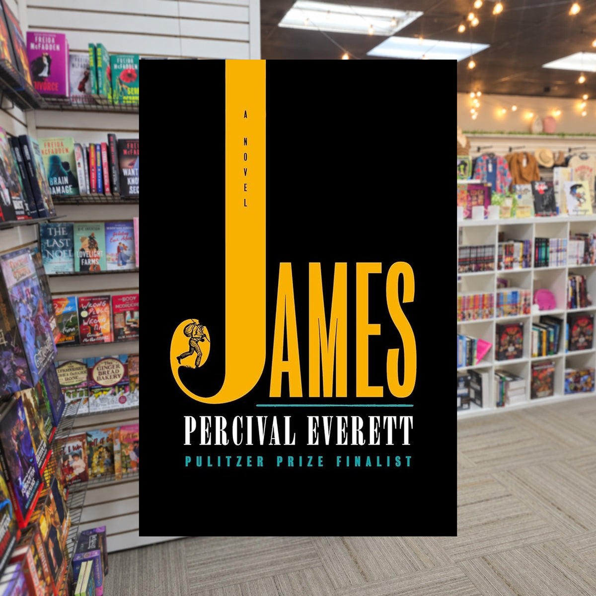 James by Percival Everett — actual cover on The Perk bookstore background