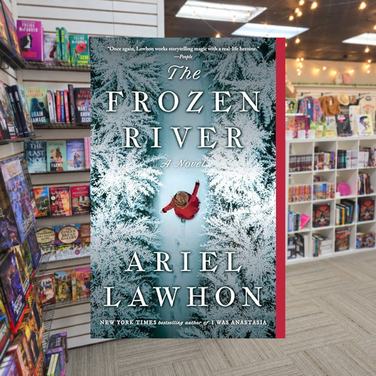 The Frozen River by Ariel Lawhon — actual cover on The Perk bookstore background