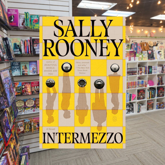 Intermezzo by Sally Rooney — actual cover on The Perk bookstore background