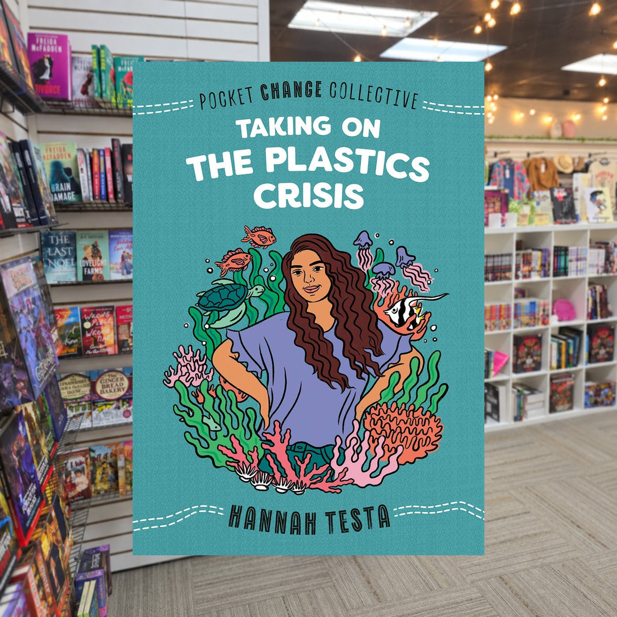 Taking on the Plastics Crisis by Hannah Testa — actual cover on The Perk bookstore background