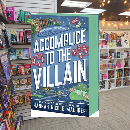 Accomplice to the Villain by Hannah Nicole Maehrer — actual cover on The Perk bookstore background