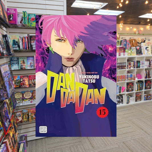 Dandadan, Vol. 15 by Yukinobu Tatsu — actual cover on The Perk bookstore background