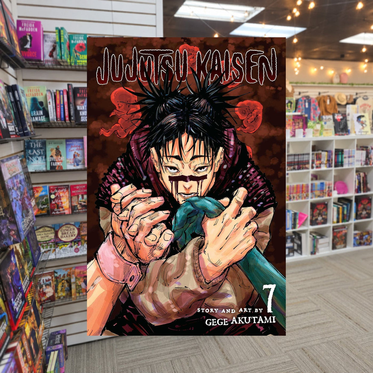 Jujutsu Kaisen Vol 7 by Gege Akutami — actual cover on The Perk bookstore background