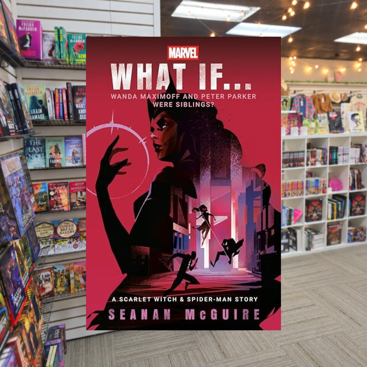 Marvel: What If... Wanda Maximoff and Peter Parker Were Siblings? by Seanan McGuire — actual cover on The Perk bookstore background