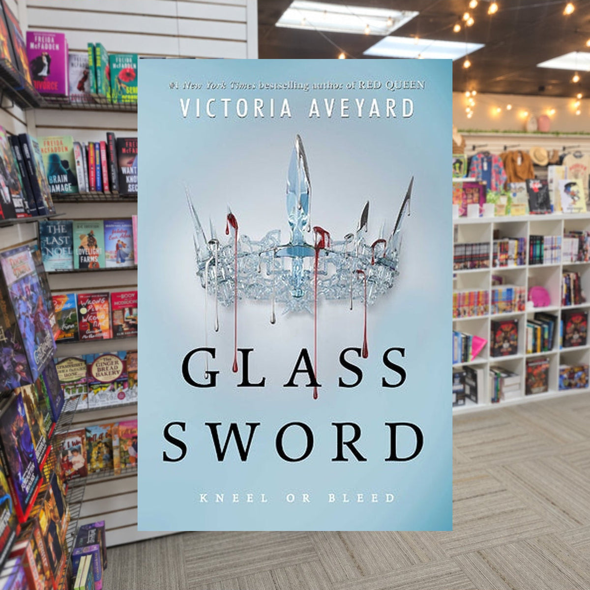 Glass Sword by Victoria Aveyard — actual cover on The Perk bookstore background