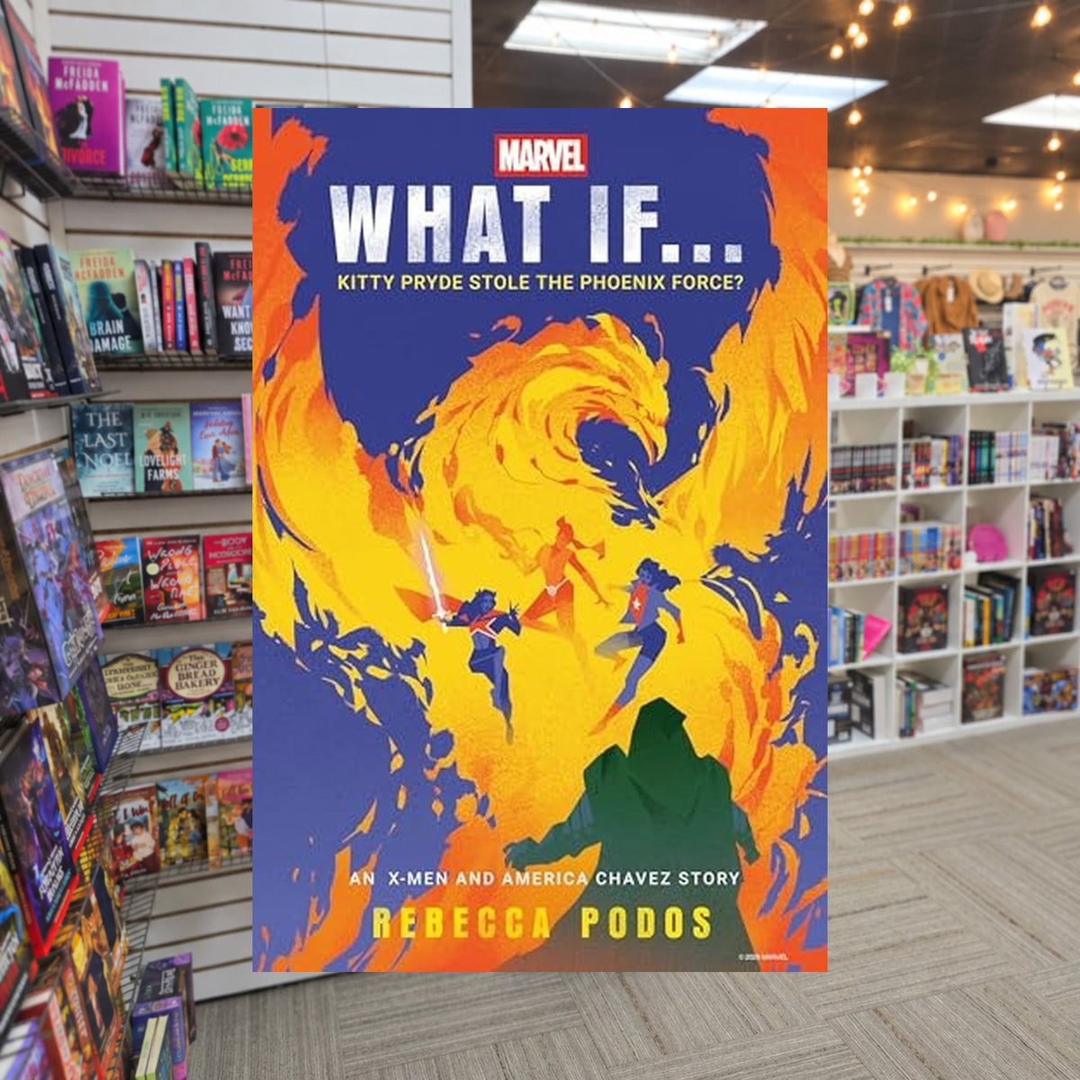 What If... Kitty Pryde Stole the Phoenix Force by Rebecca Podos — actual cover on The Perk bookstore background