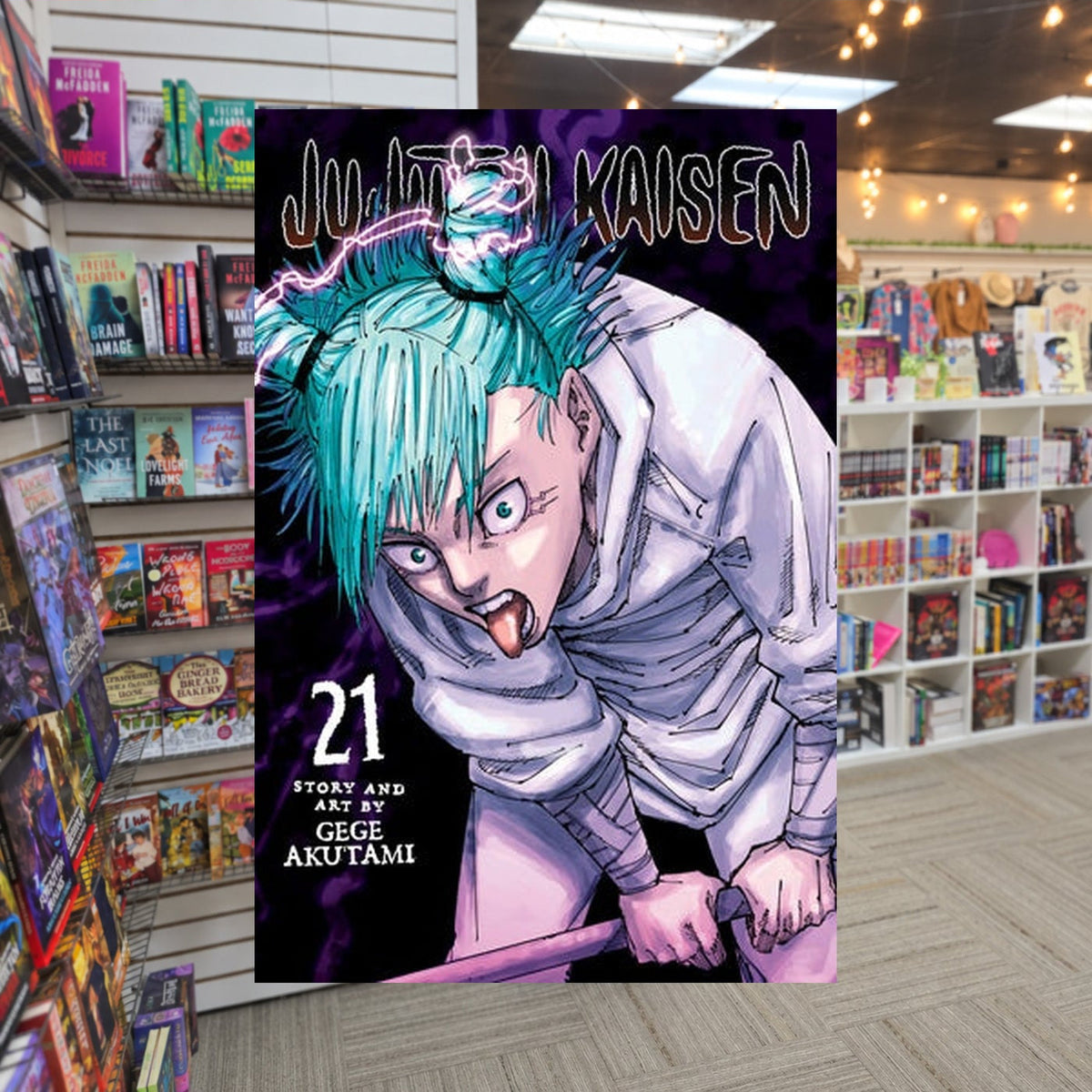 Jujutsu Kaisen, Vol. 21 by Gege Akutami — actual cover on The Perk bookstore background