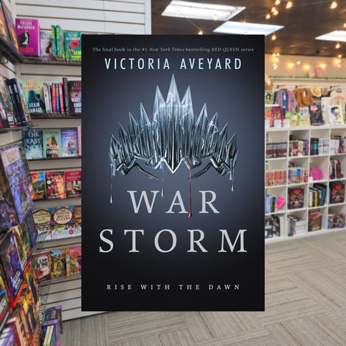 War Storm by Victoria Aveyard — actual cover on The Perk bookstore background