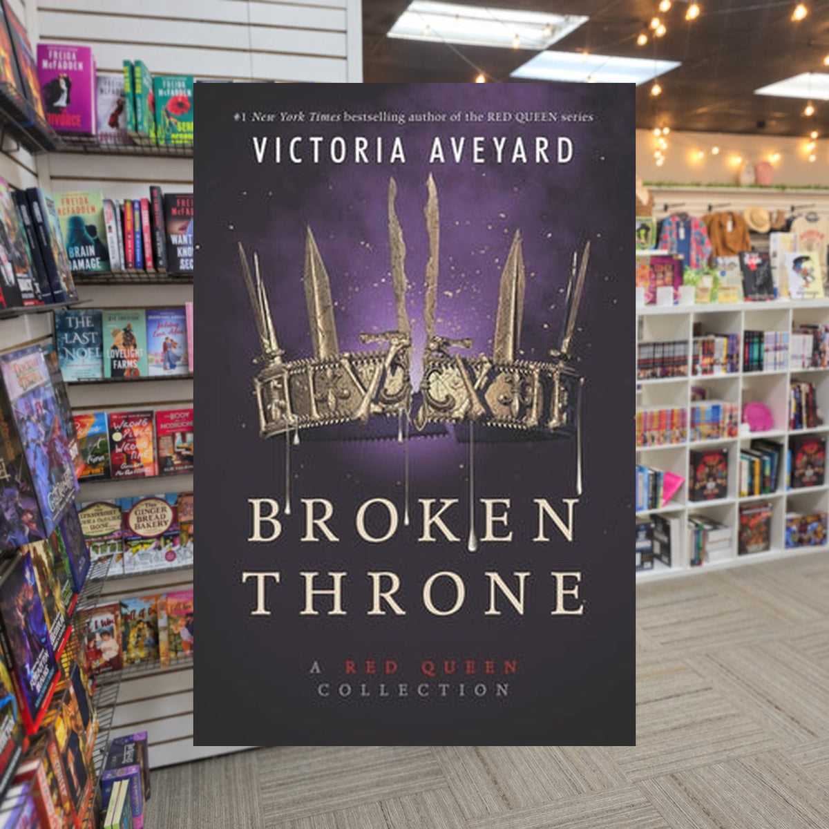 Broken Throne Collection by Victoria Aveyard — actual cover on The Perk bookstore background