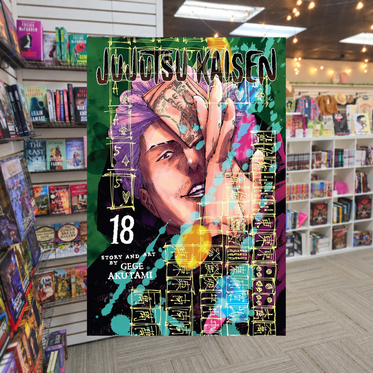 Jujutsu Kaisen, Vol. 18 by Gege Akutami — actual cover on The Perk bookstore background
