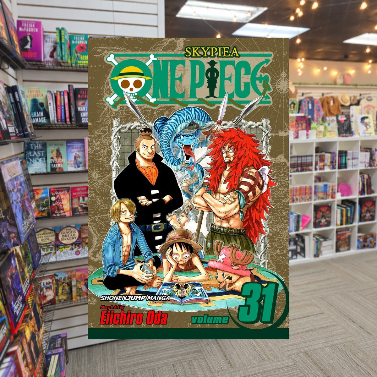 One Piece, Volume 31: We'll Be Here by Eiichiro Oda — actual cover on The Perk bookstore background