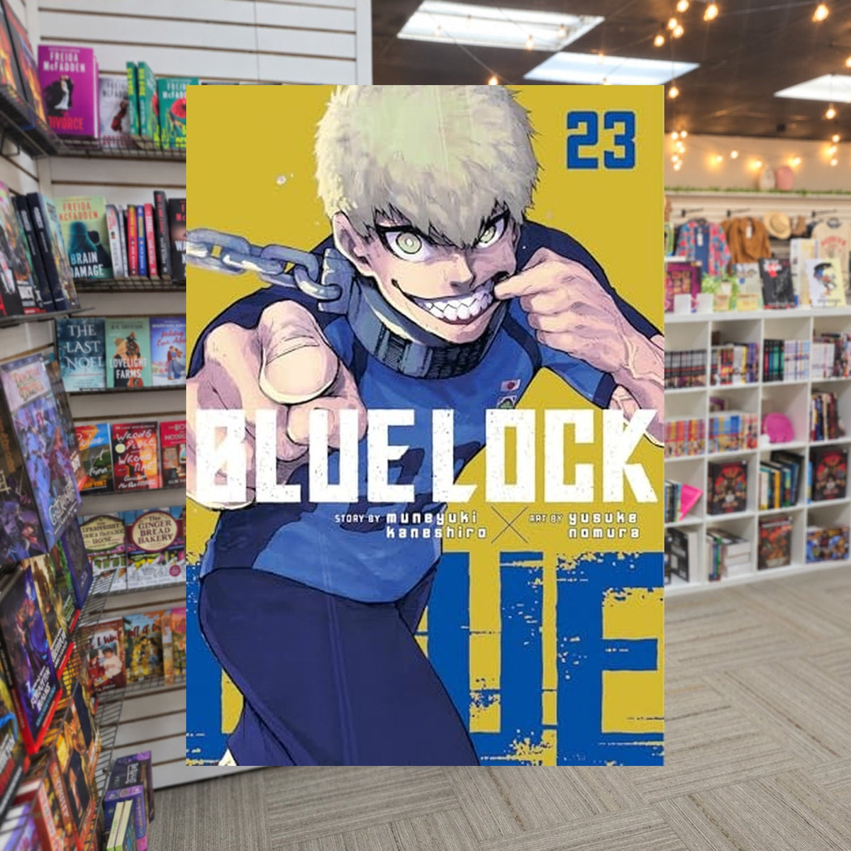 Blue Lock 223 by Muneyuki Kaneshiro — actual cover on The Perk bookstore background
