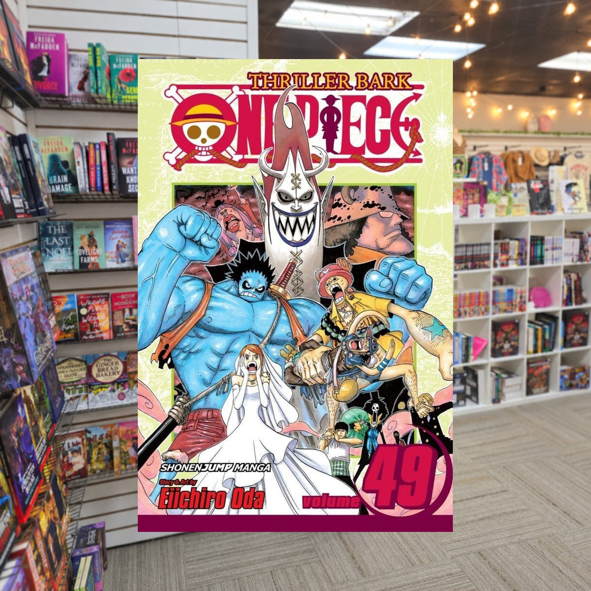 One Piece, Volume 49: Nightmare Luffy by Eiichiro Oda — actual cover on The Perk bookstore background