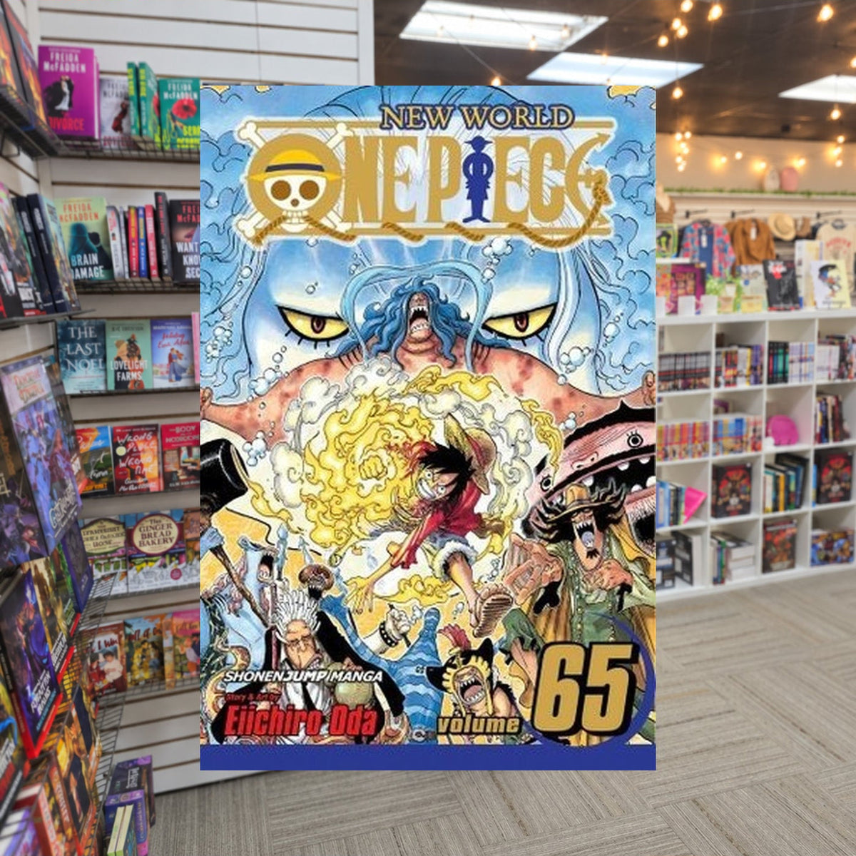 One Piece, Volume 65: To Nothing by Eiichiro Oda — actual cover on The Perk bookstore background