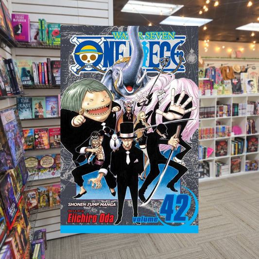 One Piece, Volume 42: Pirates vs. CP9 by Eiichiro Oda — actual cover on The Perk bookstore background