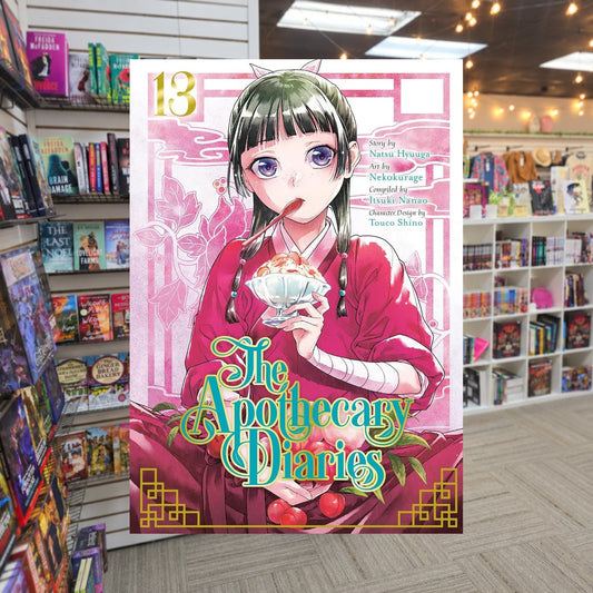 The Apothecary Diaries, Vol. 13 by Nekokurage and Natsu Hyuuga — actual cover on The Perk bookstore background