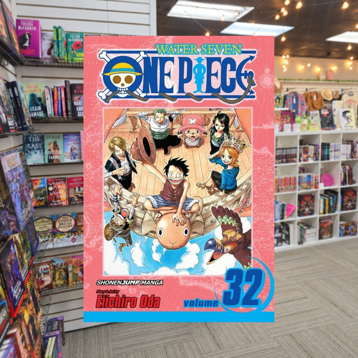 One Piece, Volume 32: Love Song by Eiichiro Oda — actual cover on The Perk bookstore background