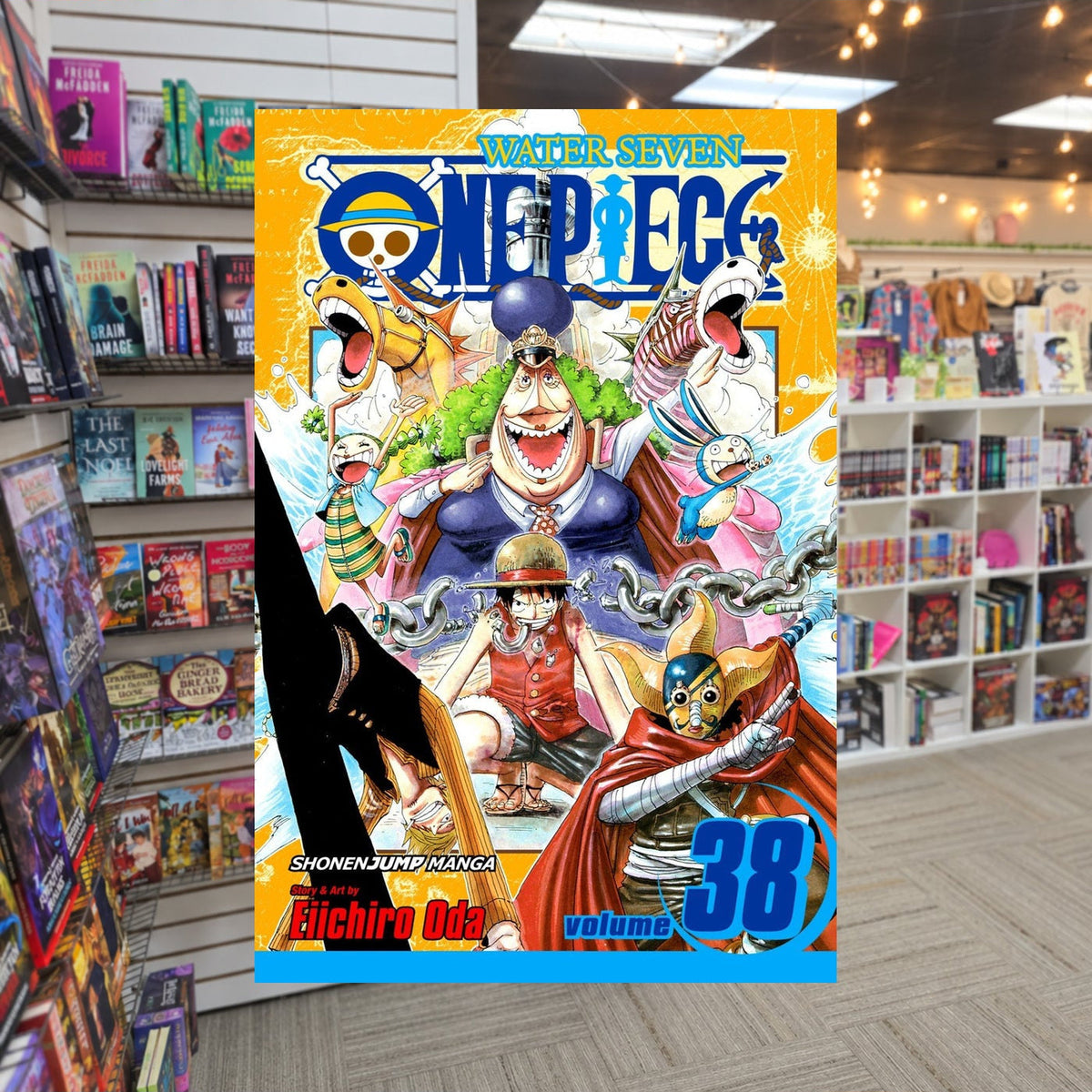 One Piece, Volume 38: Rocketman!! by Eiichiro Oda — actual cover on The Perk bookstore background