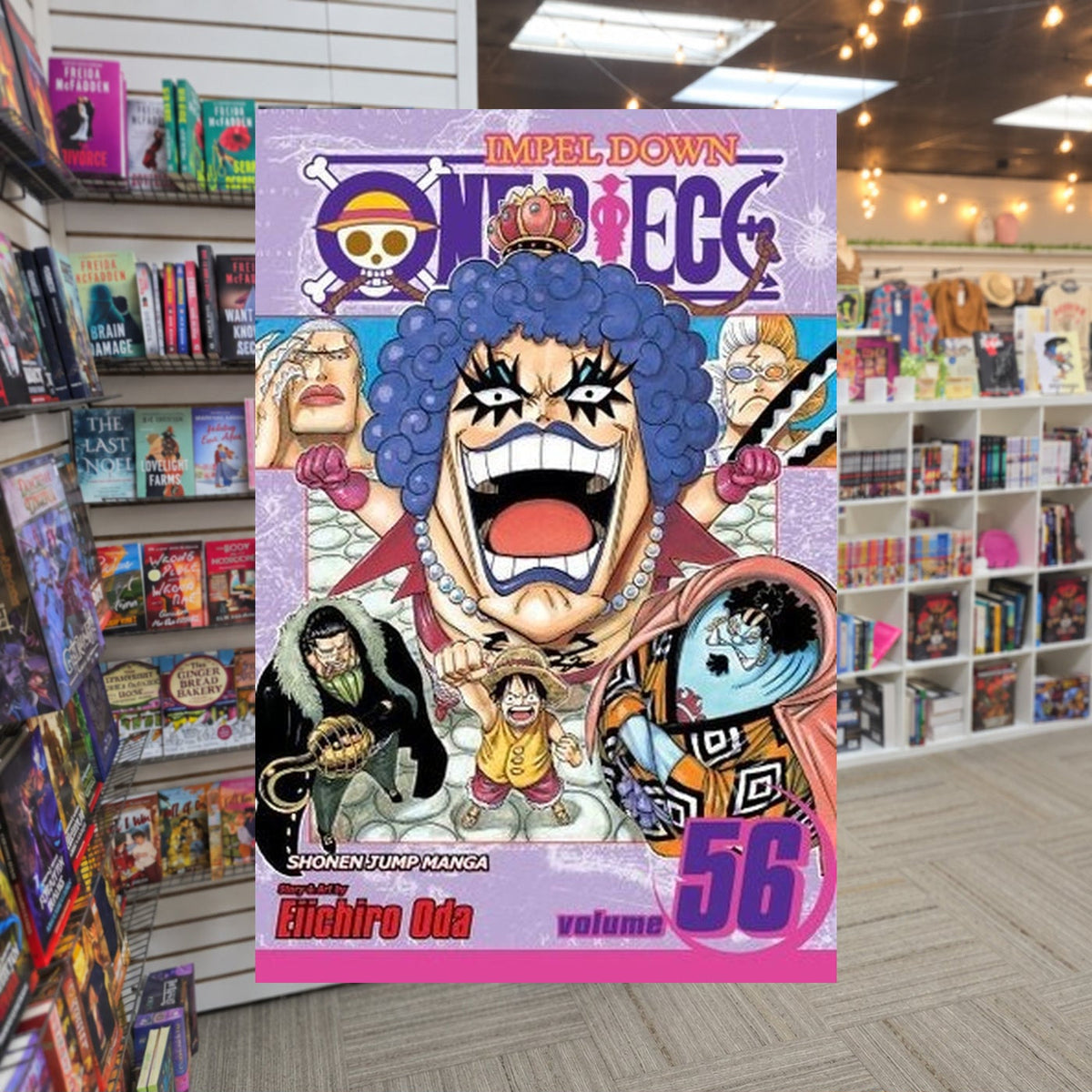 One Piece, Volume 56: Thank You by Eiichiro Oda — actual cover on The Perk bookstore background