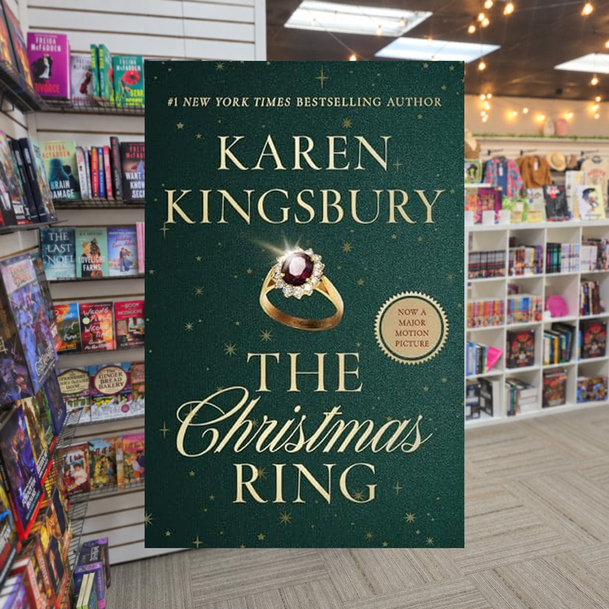 The Christmas Ring by Karen Kingsbury — actual cover on The Perk bookstore background