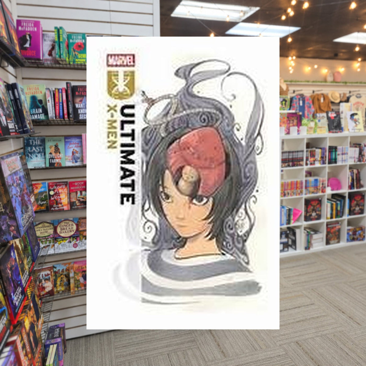 Ultimate X-Men Vol. 3: The Realm Of The Mind by Peach Momoko — actual cover on The Perk bookstore background