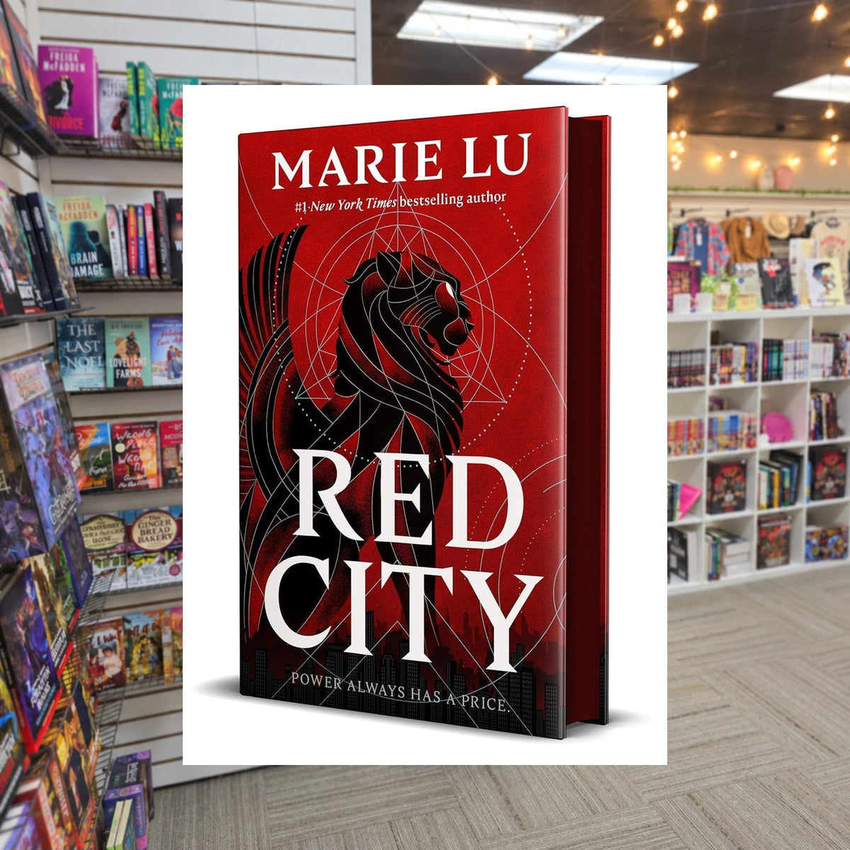 Red City by Marie Lu — actual cover on The Perk bookstore background